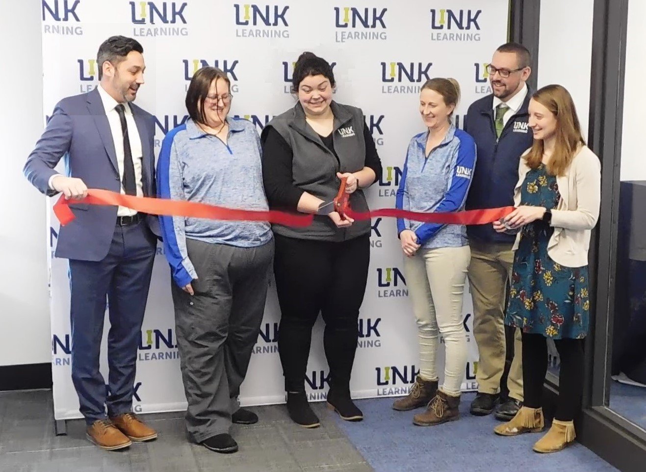 The ribbon is cut Thursday, Feb. 2, officially marking the establishment of Harrison’s new Link Learning Center.